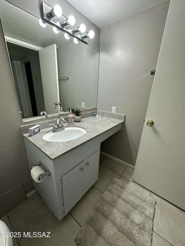 bathroom with vanity and tile patterned floors