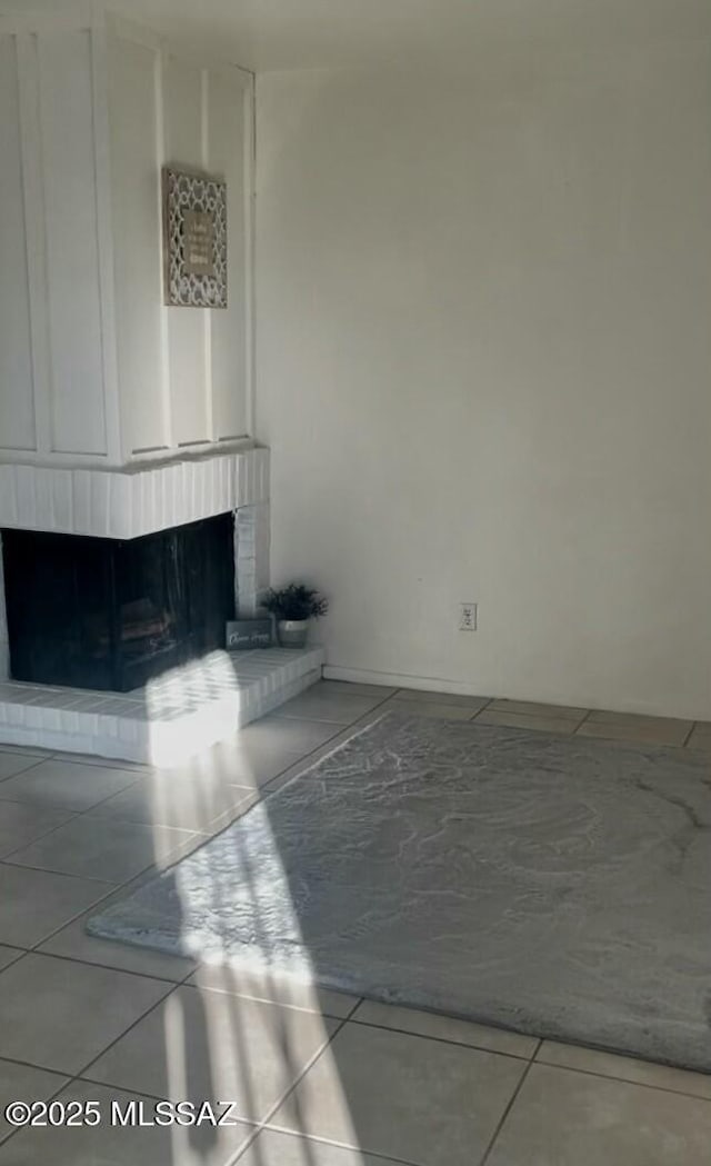 unfurnished living room featuring tile patterned floors