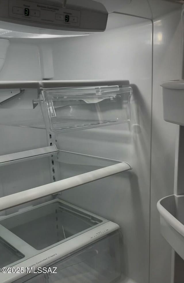 interior details featuring refrigerator