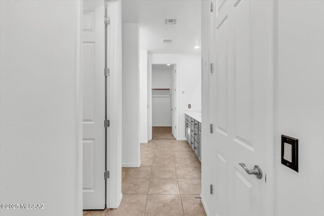 corridor featuring light tile patterned flooring