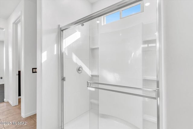 bathroom featuring tile patterned flooring and walk in shower