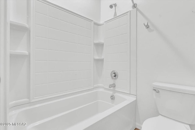 bathroom featuring toilet and tub / shower combination