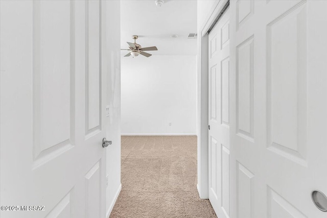 hallway with light carpet