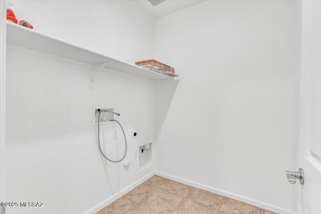 laundry room with hookup for a washing machine, electric dryer hookup, and light tile patterned flooring