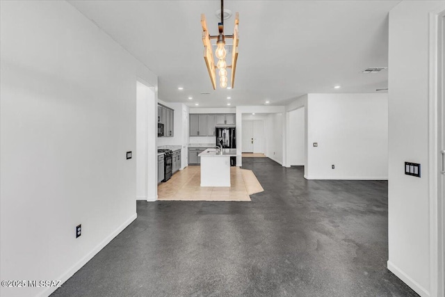 unfurnished living room featuring sink