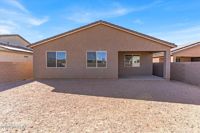 rear view of property with a patio