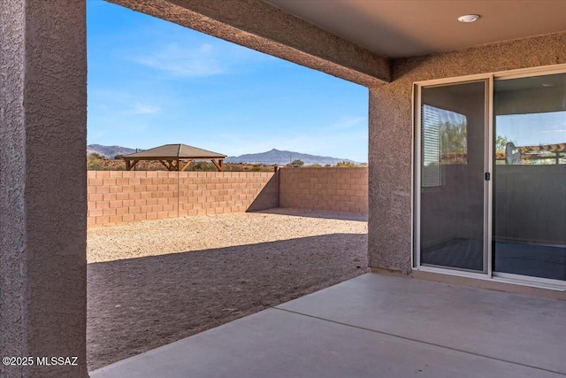 view of patio / terrace with a mountain view