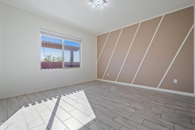 unfurnished room featuring light hardwood / wood-style flooring