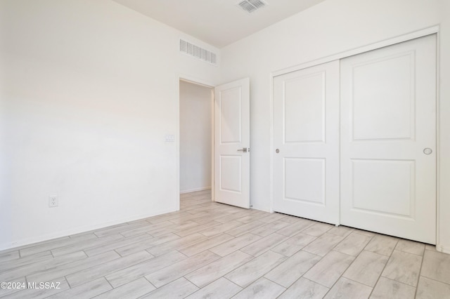 unfurnished bedroom featuring a closet