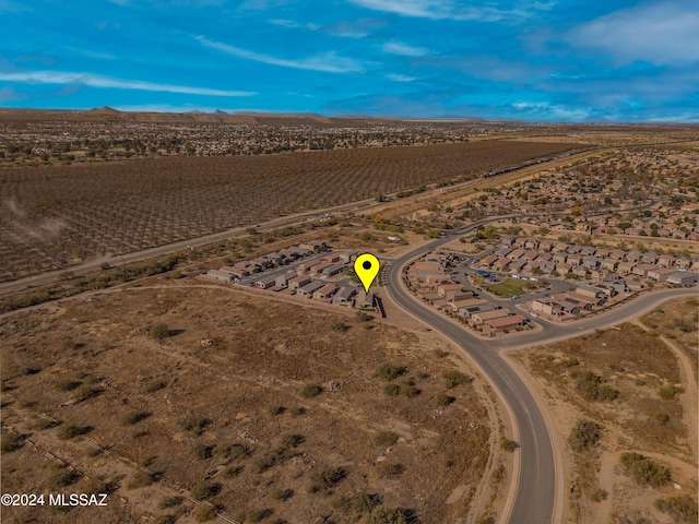 birds eye view of property featuring a desert view and a rural view