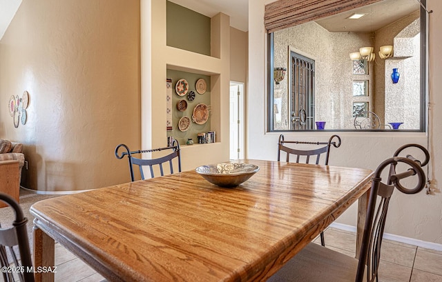 dining area with light tile patterned floors