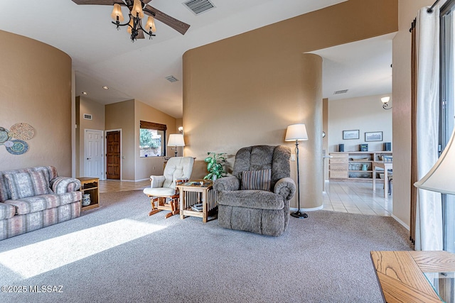 carpeted living room with vaulted ceiling and ceiling fan