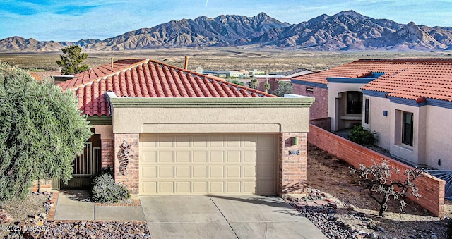 view of front of house featuring a mountain view and a garage