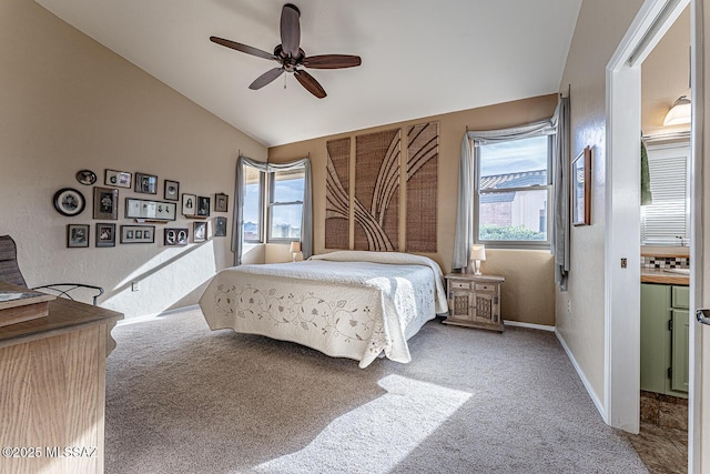 bedroom featuring multiple windows, ceiling fan, carpet floors, and vaulted ceiling