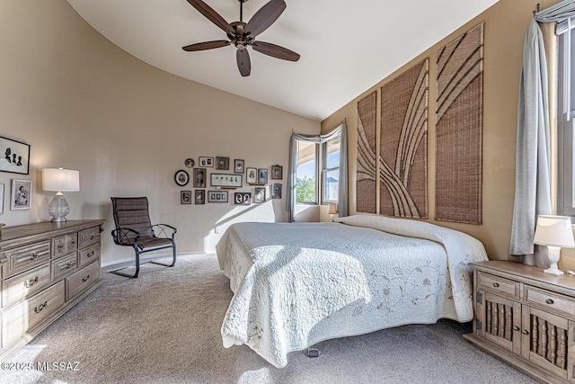 carpeted bedroom featuring ceiling fan and lofted ceiling