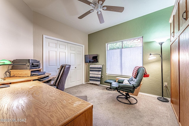 home office featuring ceiling fan and carpet floors