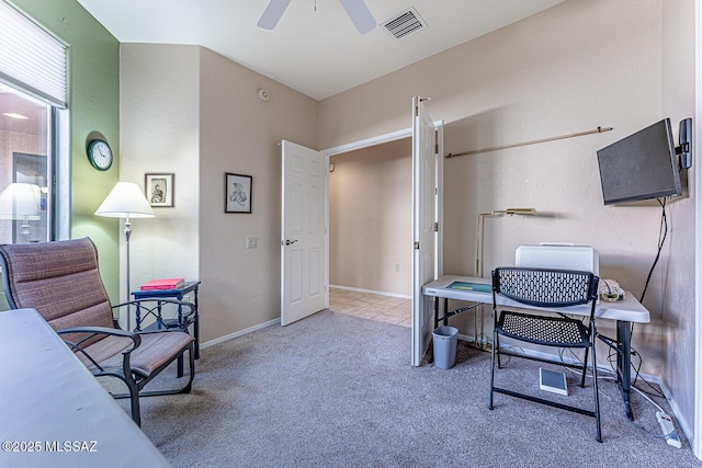 carpeted home office with ceiling fan