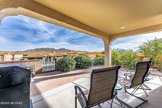 view of patio featuring area for grilling and a mountain view