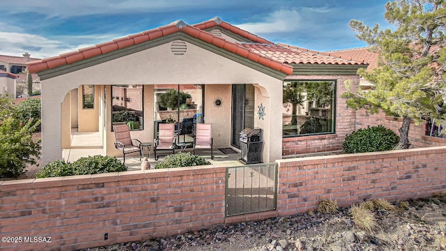 mediterranean / spanish-style home with a patio