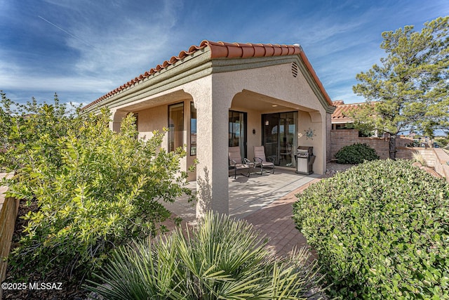 rear view of house featuring a patio area