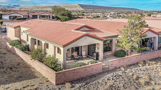 exterior space with cooling unit and a patio area