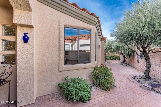 view of property exterior featuring a patio area