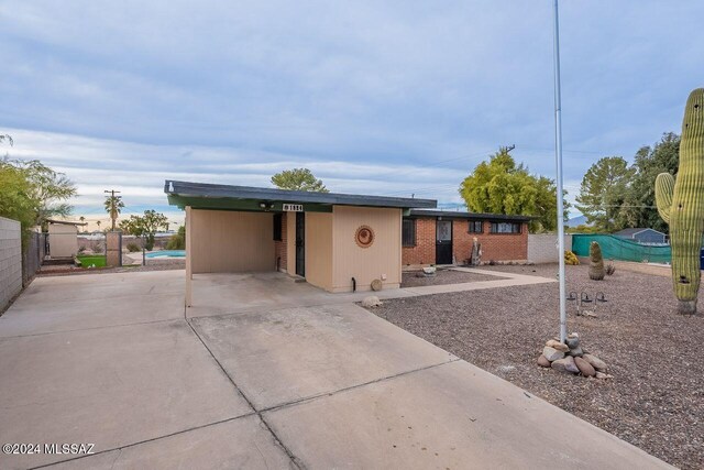 view of front of home featuring a carport