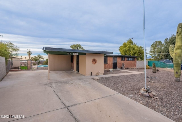 view of front of home featuring a carport