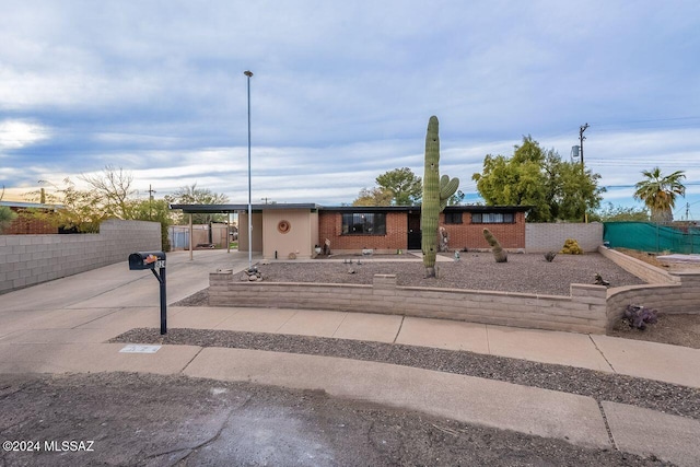 view of front of property with a carport