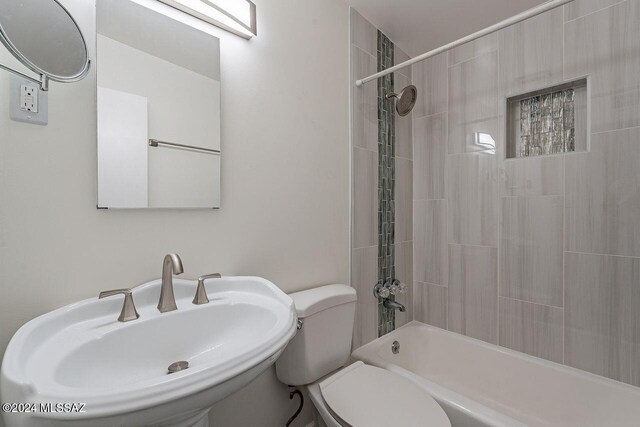 full bathroom featuring shower / bathtub combination, toilet, and sink