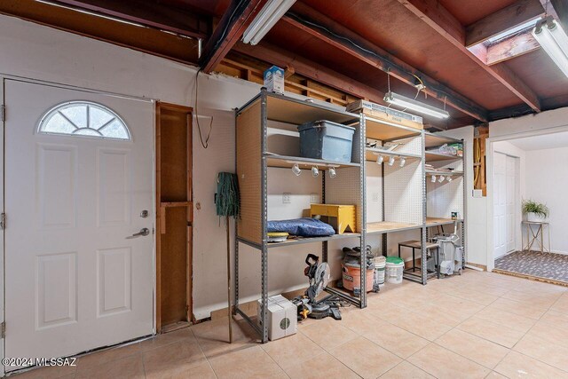 basement featuring tile patterned flooring