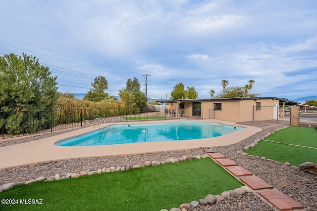 view of swimming pool featuring a patio area