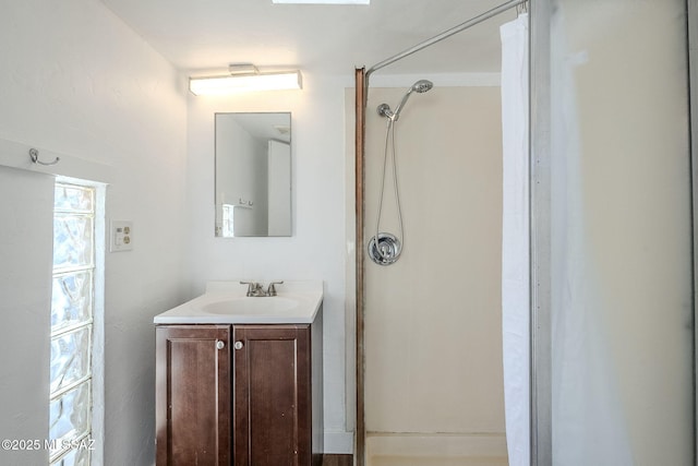 bathroom with vanity and walk in shower