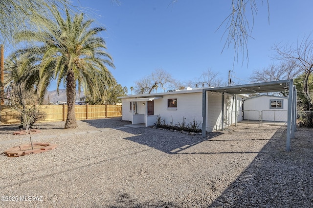 ranch-style house featuring a carport