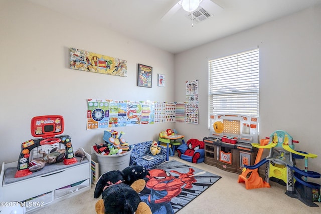 game room with ceiling fan and carpet