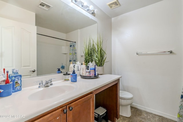 bathroom with vanity, toilet, and walk in shower