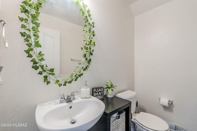 bathroom with toilet and sink