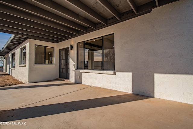 doorway to property featuring a patio area