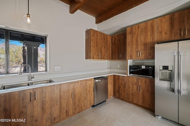 kitchen with wood ceiling, stainless steel appliances, sink, decorative light fixtures, and beamed ceiling