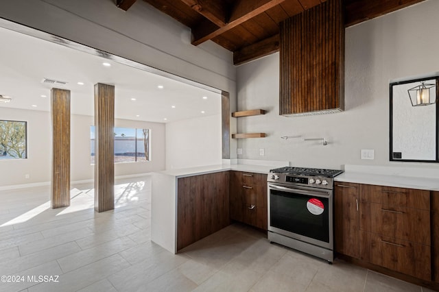 kitchen featuring beam ceiling, wood ceiling, and gas range