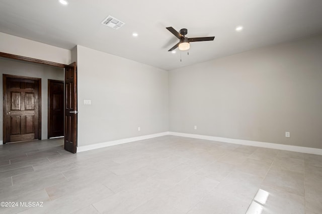 spare room with ceiling fan