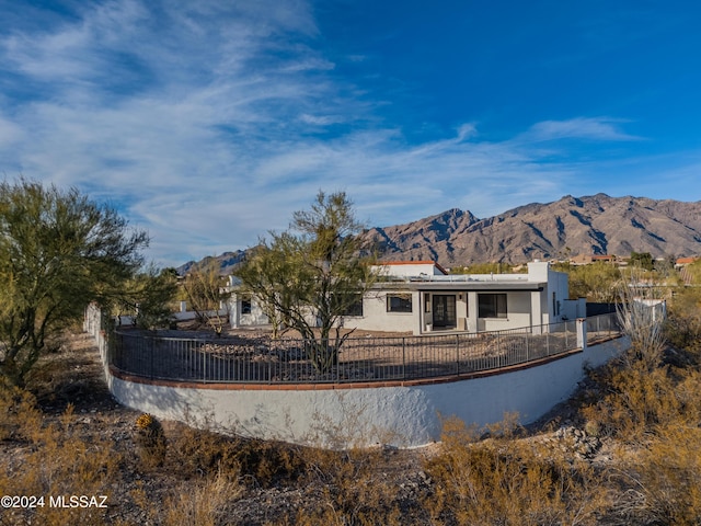 rear view of property featuring a mountain view