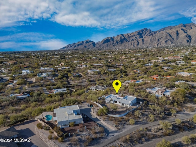 birds eye view of property featuring a mountain view