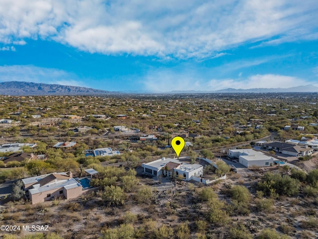 birds eye view of property featuring a mountain view