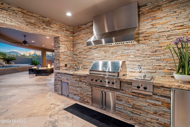 view of patio / terrace with area for grilling, ceiling fan, and sink