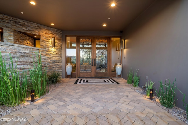 view of exterior entry featuring french doors