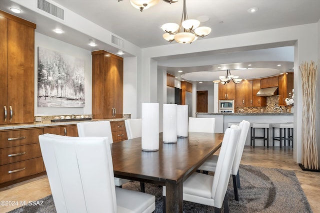 dining area featuring a notable chandelier