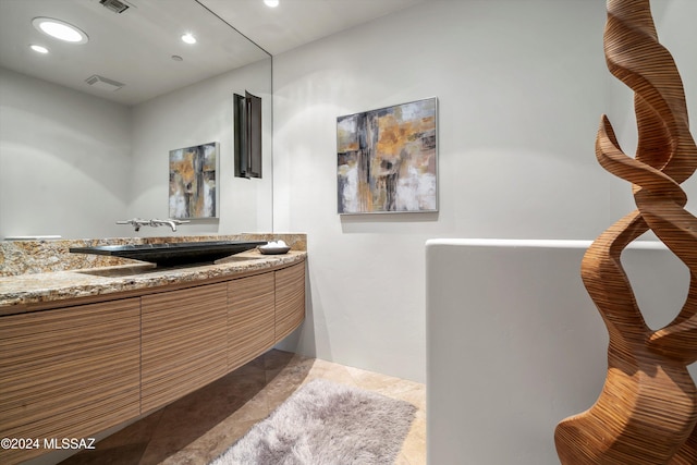 bathroom with vanity and tile patterned floors