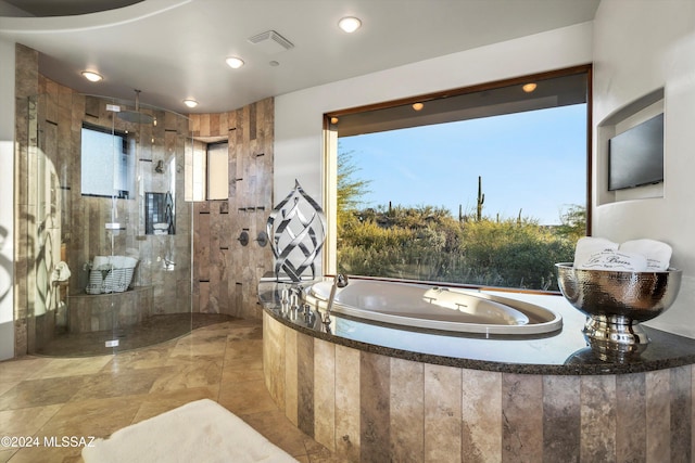 bathroom with a tile shower