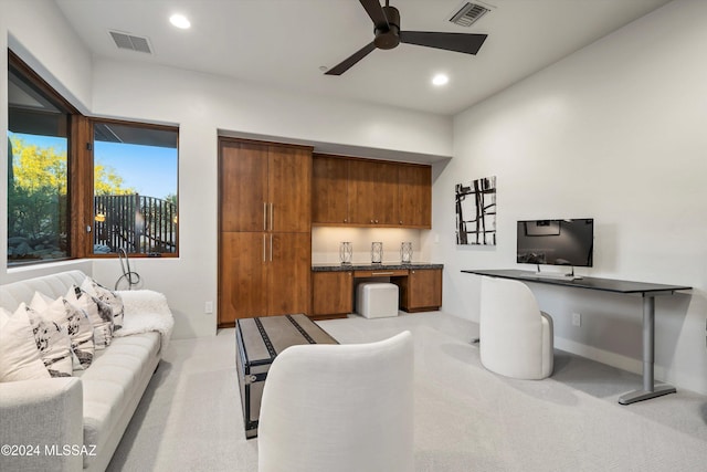 interior space with ceiling fan